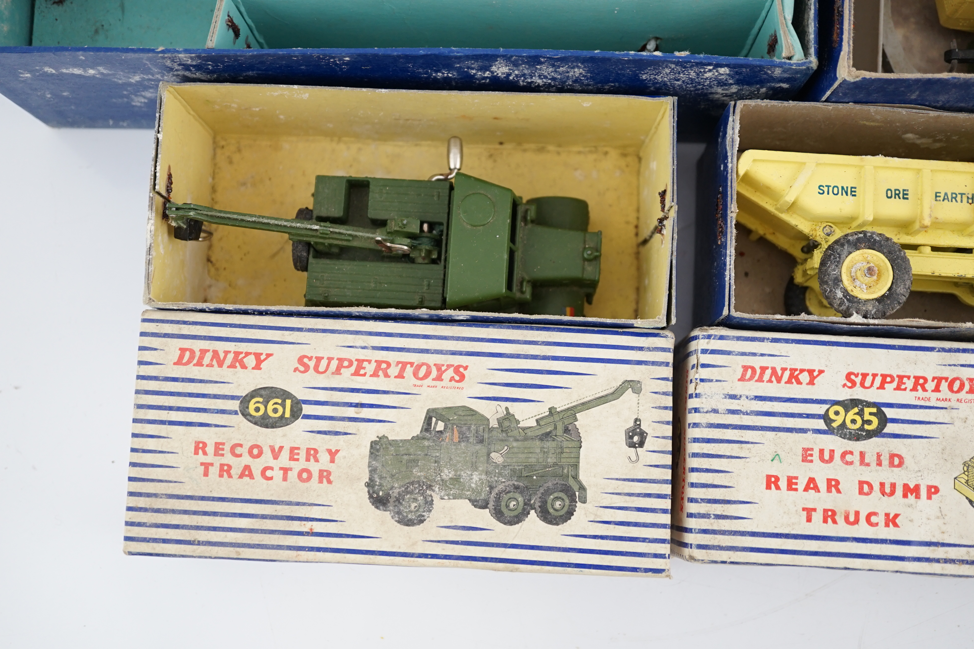 Thirteen Dinky Toys and Supertoys, etc. including; an MGB (113), a Riley Pathfinder, a Triumph Herald, an Armoured Command Vehicle (677), a 20-ton Mounted Crane (972), a Recovery Tractor (661)